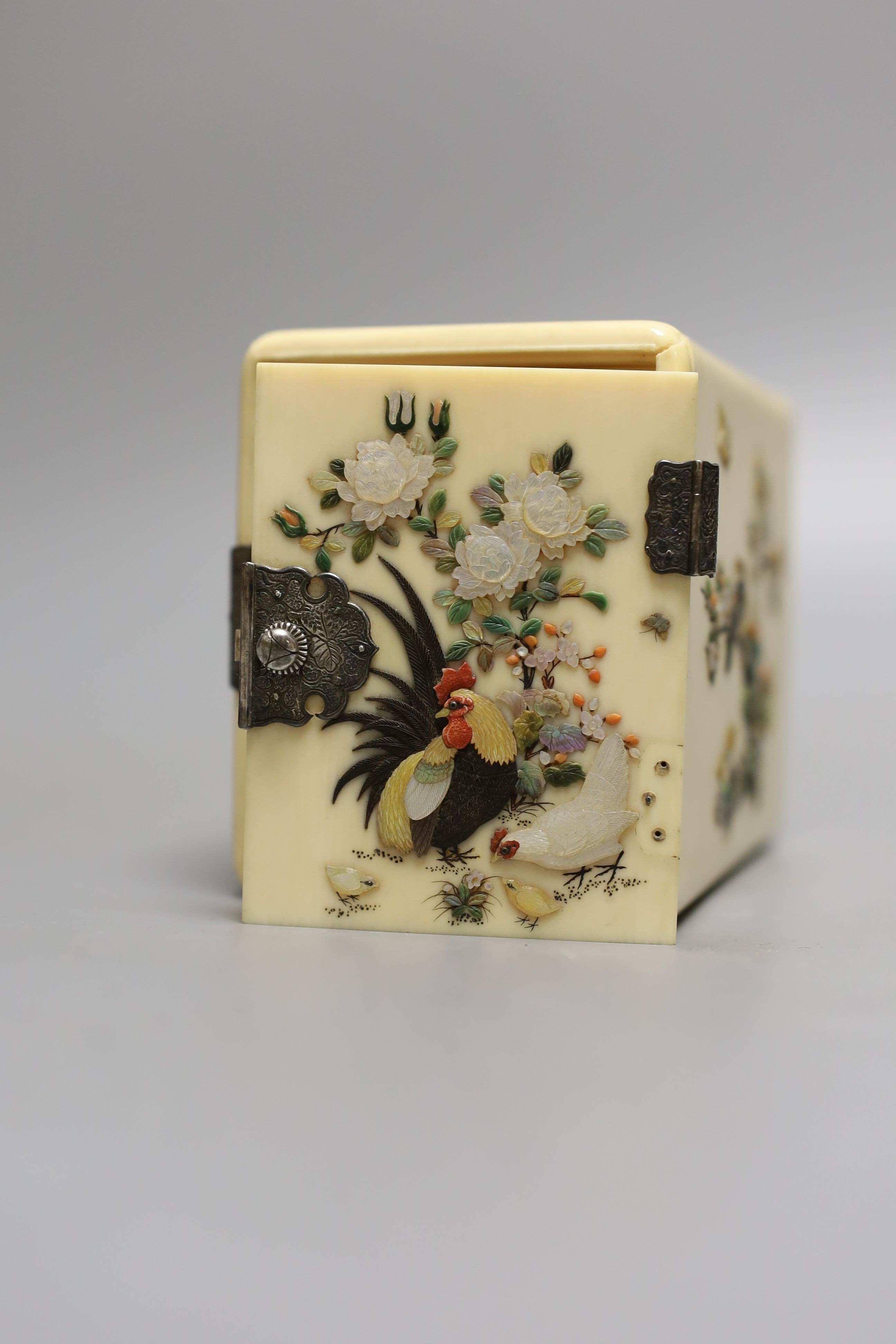 A Japanese Shibayama style ivory kodansu (table cabinet), Meiji period, with white metal lock, hinges and handles, 7cms high x 10 cms deep.